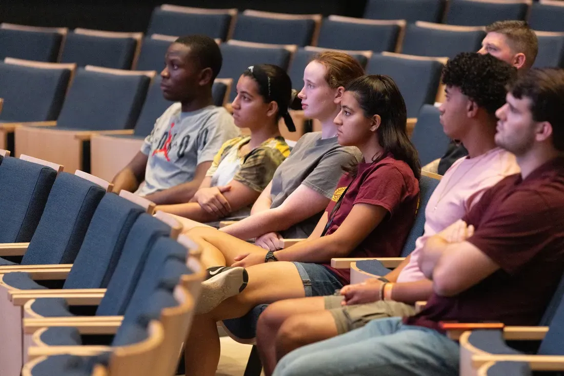 People sitting in chairs.